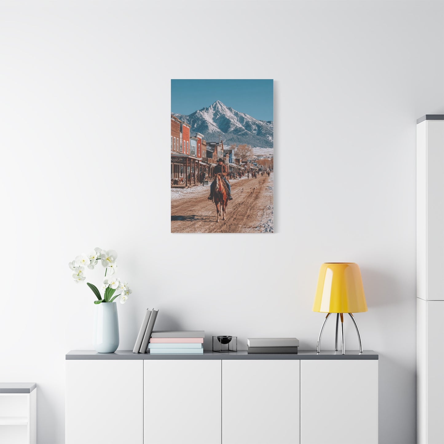 Cowboy Riding Through a Frontier Mountain Town Wall Art & Canvas Print